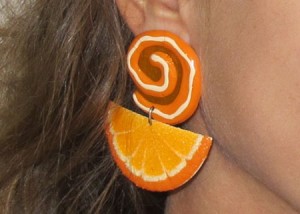 Closeup of my awesome orange slice earring from 1988. They go with my bangs.