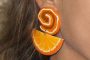 Closeup of my awesome orange slice earring from 1988. They go with my bangs.